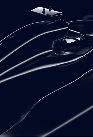 Close-up of a sleek black Formula 1 race car's aerodynamic body and rear wing.