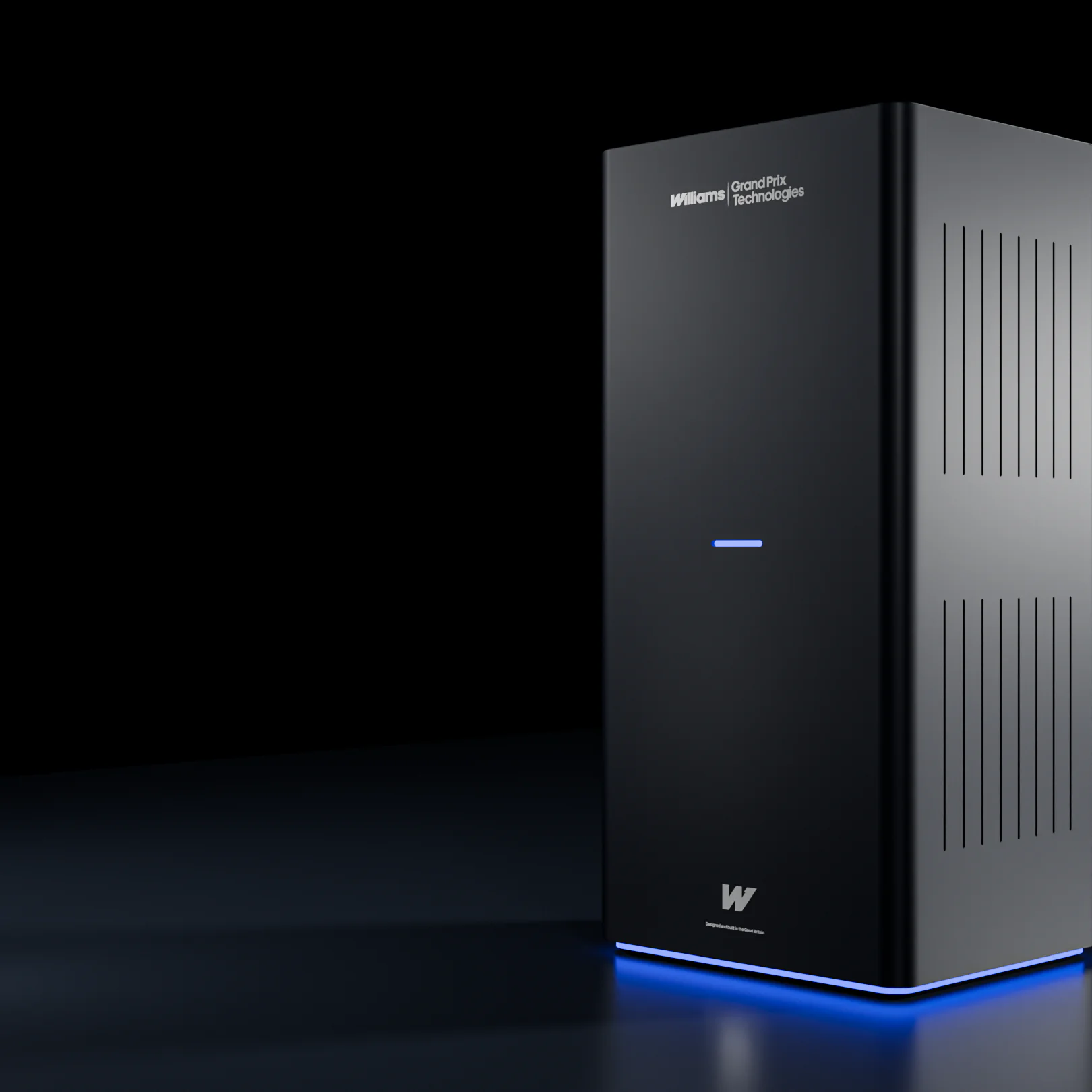 Tall black rectangular Williams Grand Prix Technologies device with blue light glow at base on dark surface.