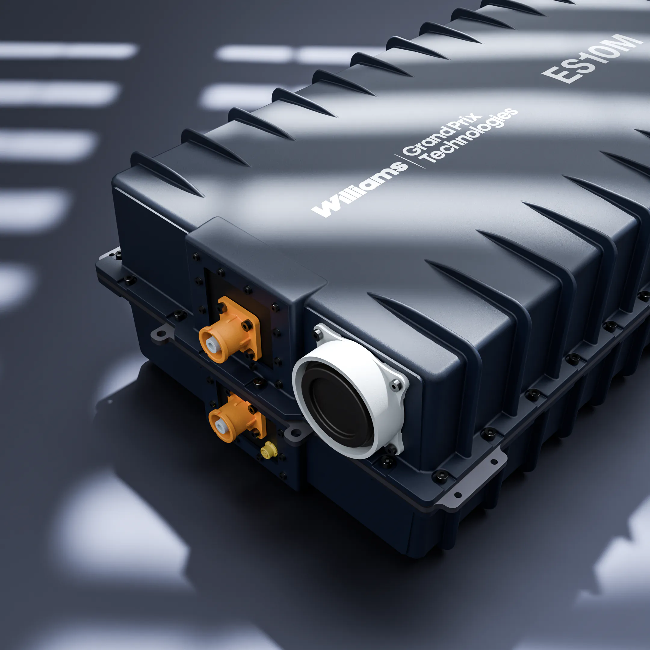 Williams GrandPrix Technologies ES10M electronic device with connectors on a dark surface.