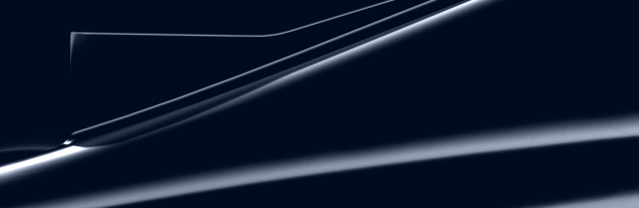 Close-up of sleek, glossy dark formula 1 car with sharp, elegant contours and reflective highlights.