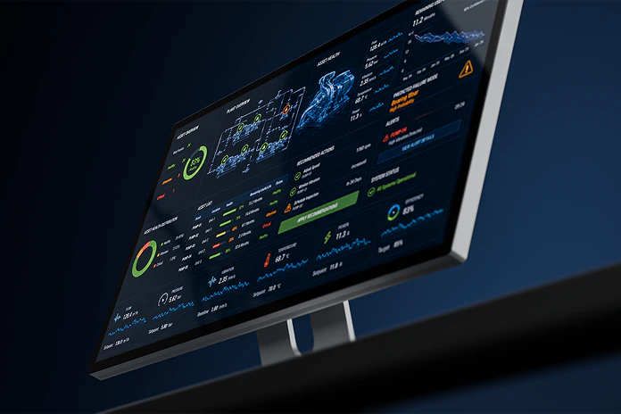 Monitor displaying the physics informed machine learning dashboard with charts, graphs, and alerts in dark mode.