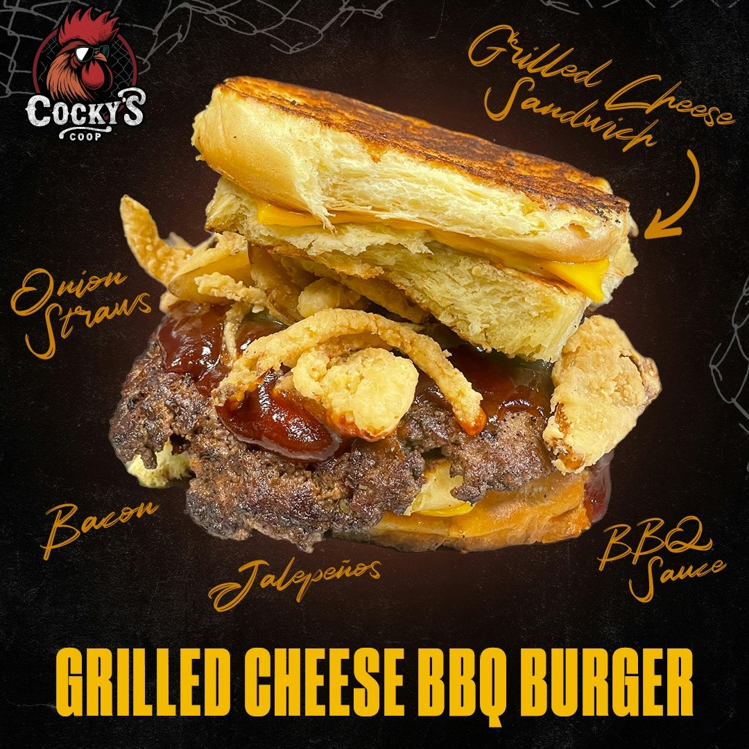 Grilled Cheese BBQ Burger with grilled cheese sandwich top bun, onion straws, bacon, jalapeños, and BBQ sauce.