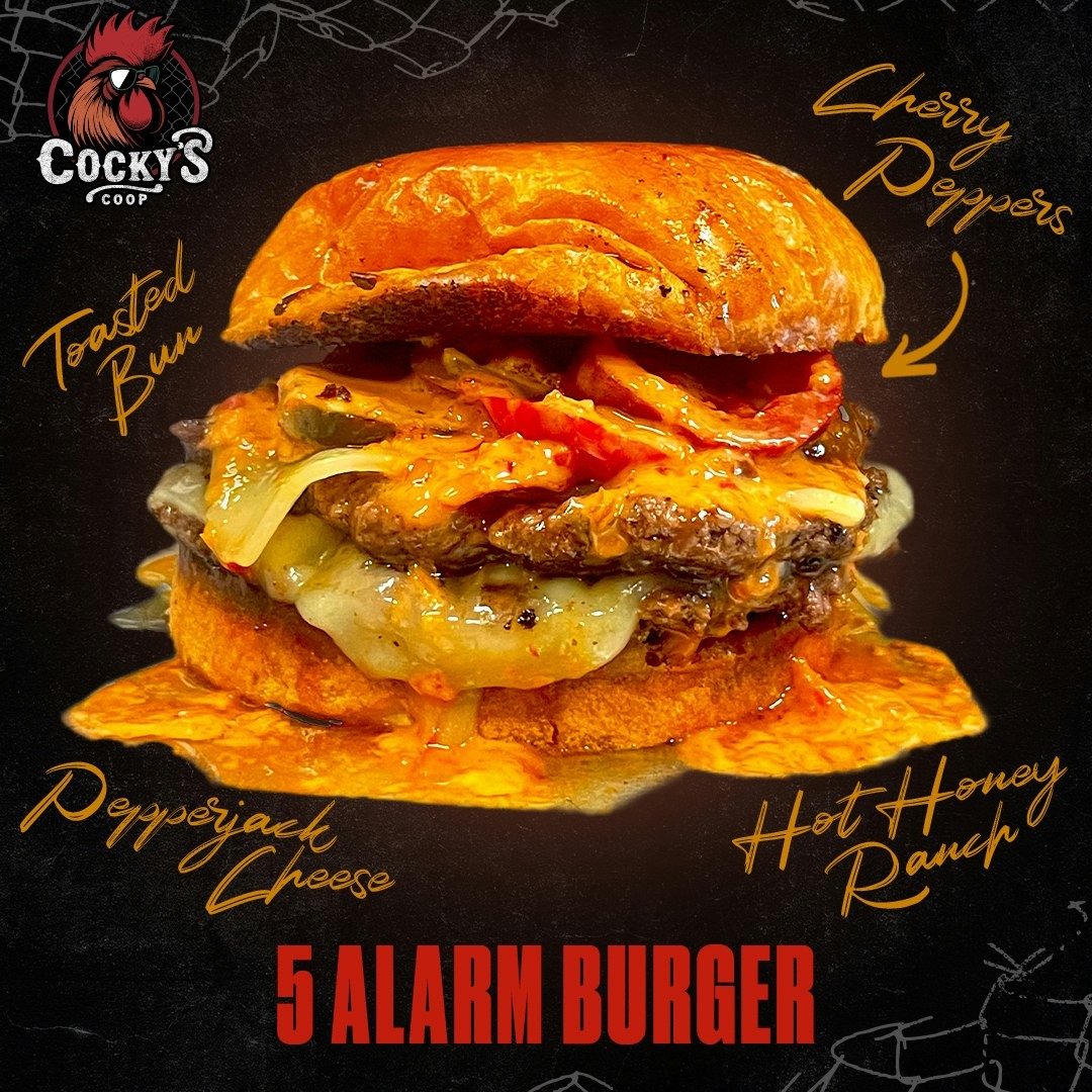 5 Alarm Burger with toasted bun, cherry peppers, pepperjack cheese, and hot honey ranch sauce.