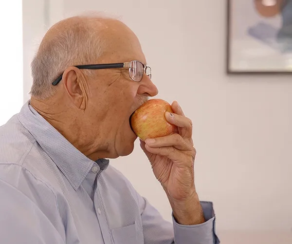 Man Biting Into an Apple
