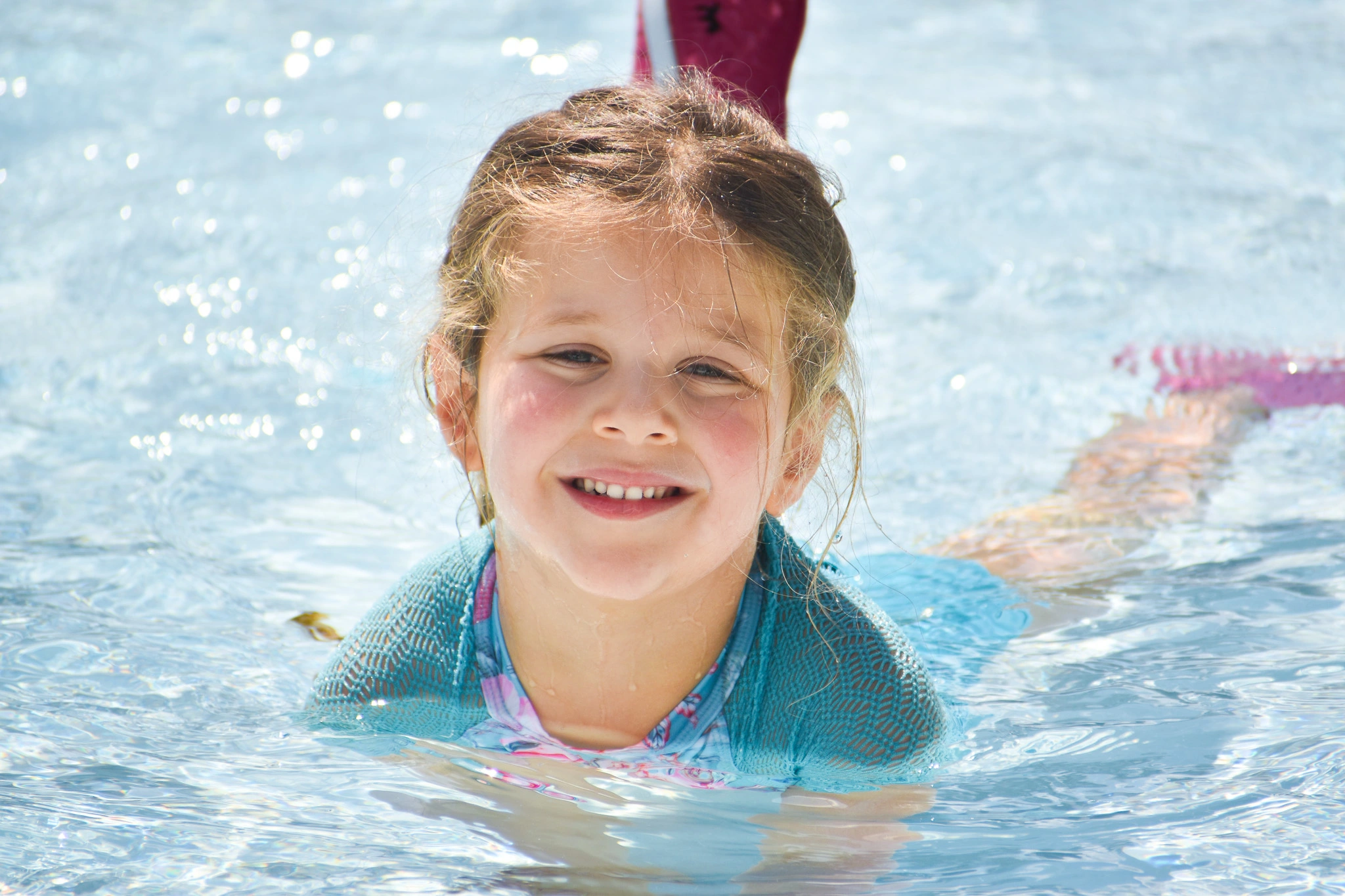 Child taking swimming lessons in boynton beach