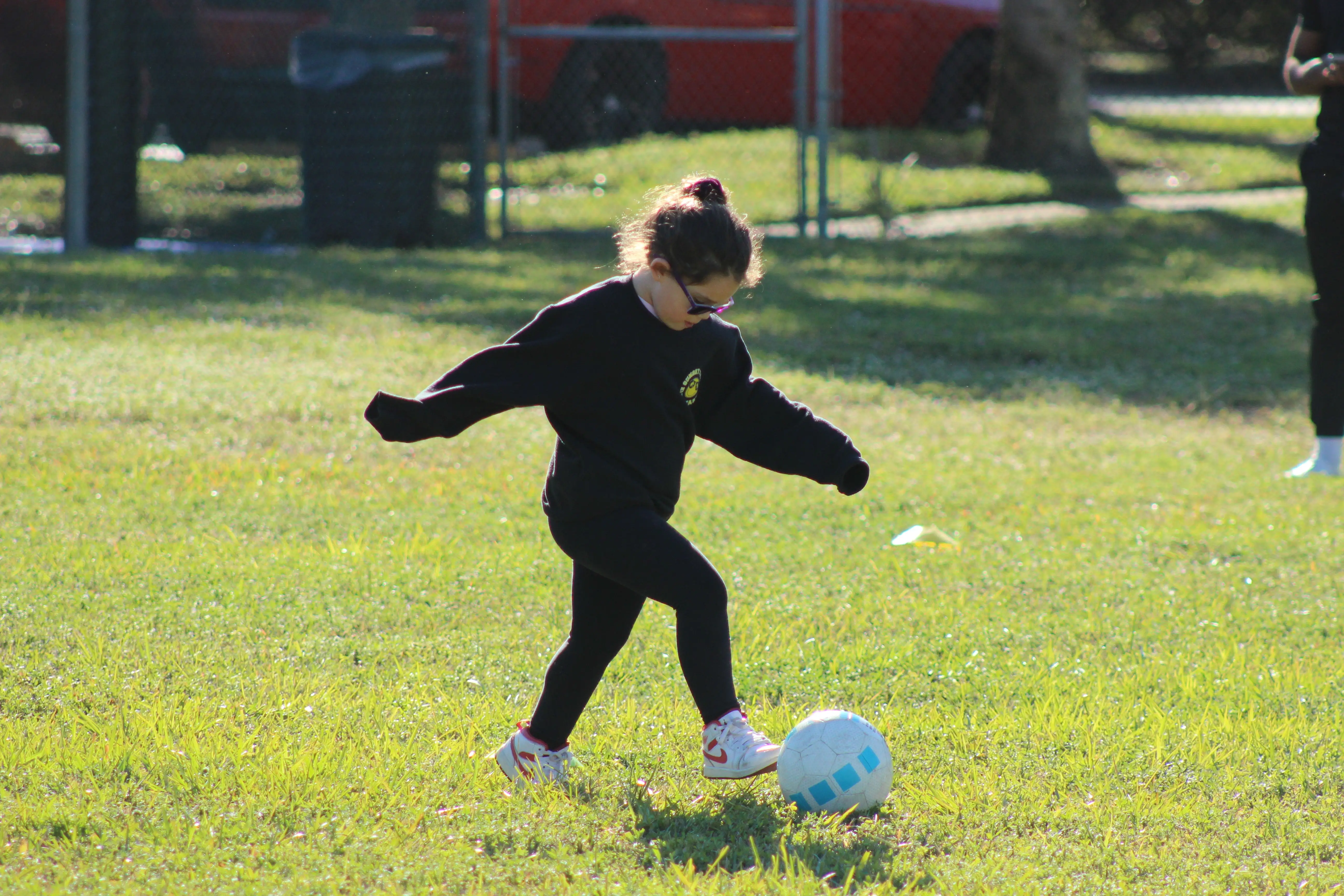 girl playing soccer at jcc spring break camp
