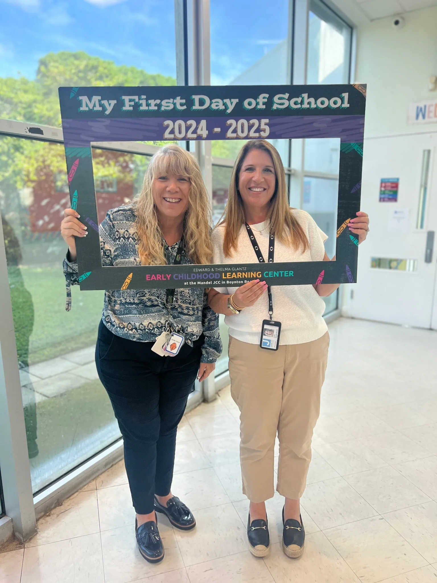 Staff members welcoming families at the Mandel JCC Early Childhood Learning Center during the first day of school