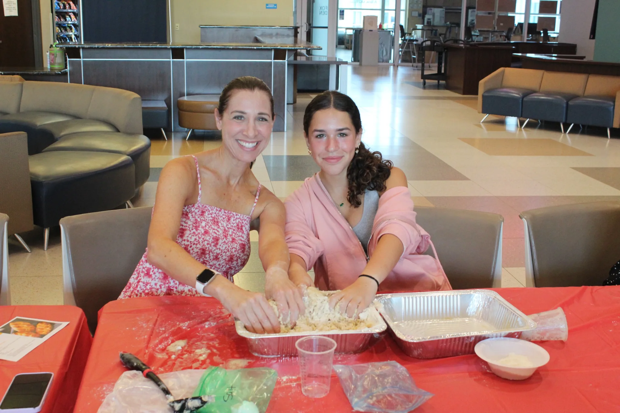 Families participating in a hands-on community activity at the Mandel JCC, highlighting engaging programs for all ages