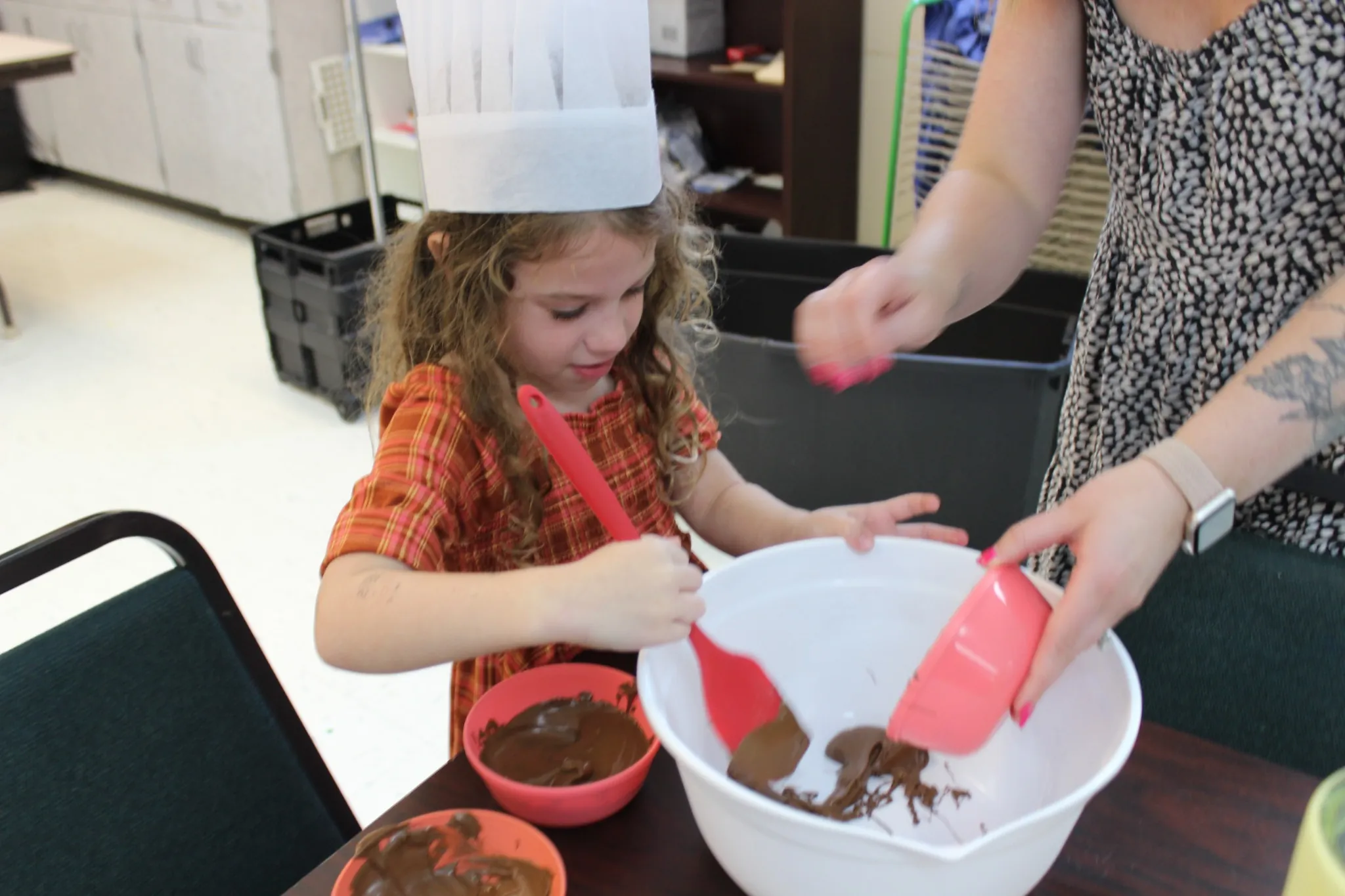 Child taking part in a fun cooking and learning activity during early childhood JCC classes