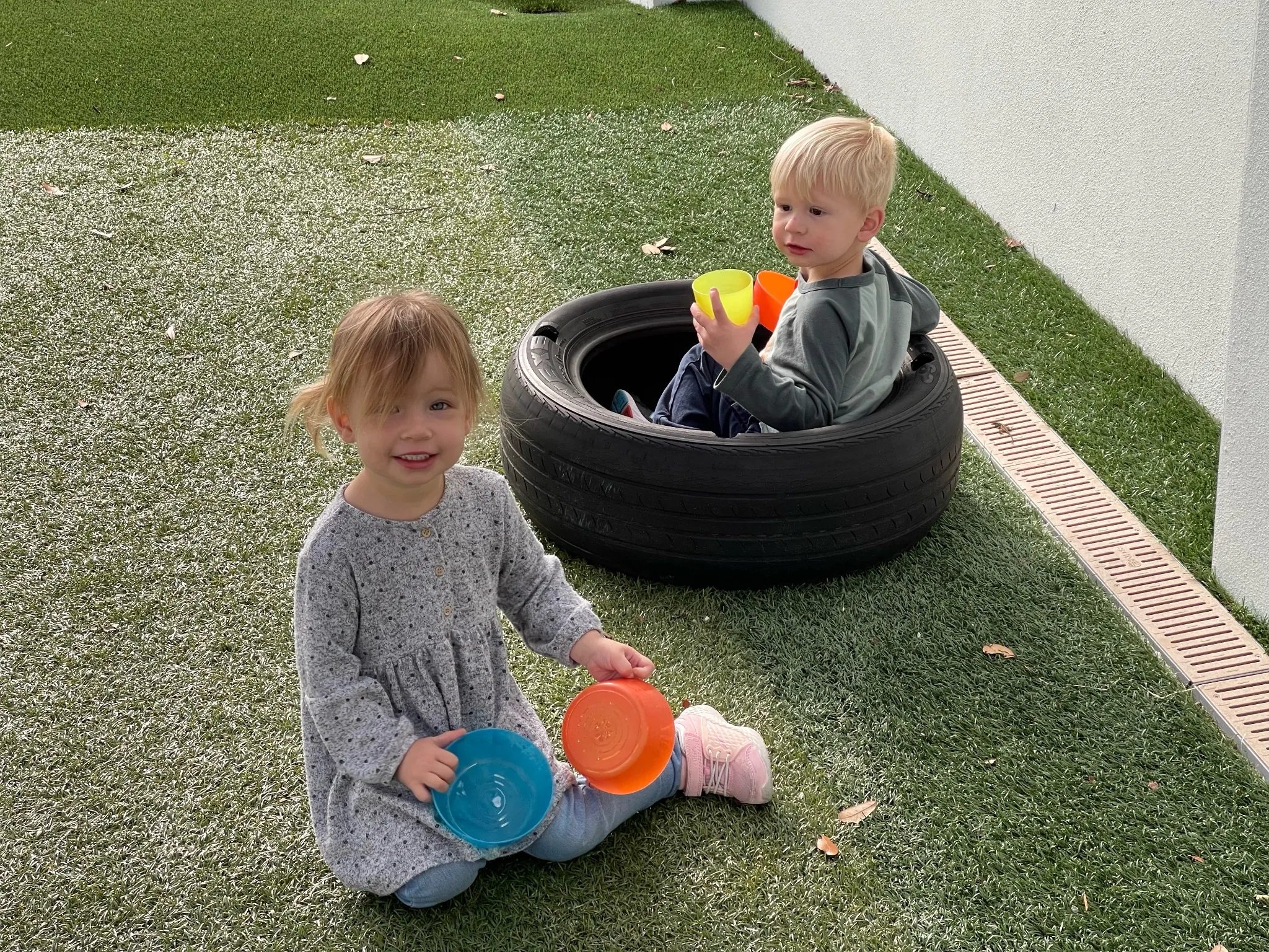 Toddlers participating in hands-on sensory play during early childhood JCC classes