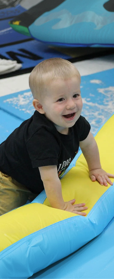 infant exploring movement and sensory materials at a daycare in Boynton Beach, FL
