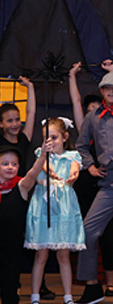 children perform onstage in enrichment program for hands on learning experience and creativity