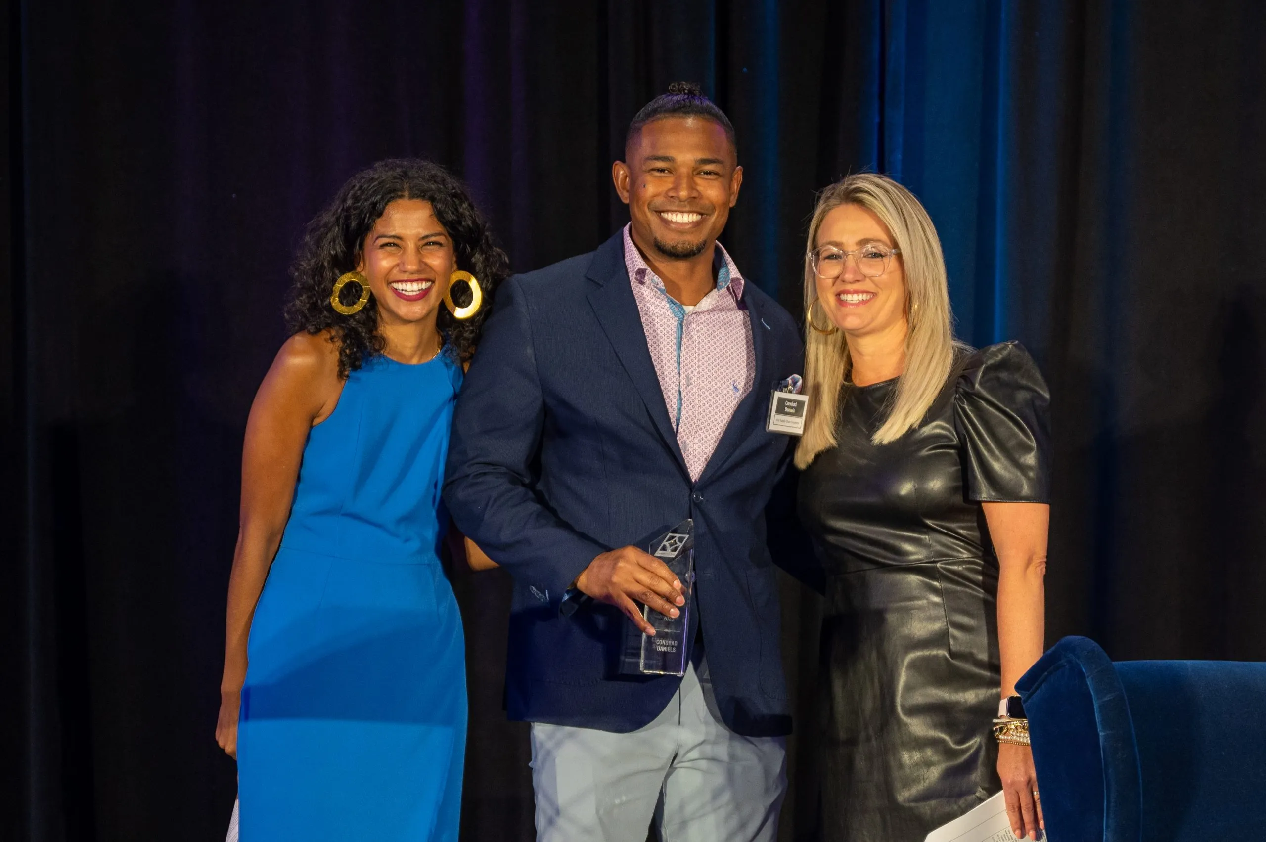 Conrad Daniels accepting the Top Impact Leader award