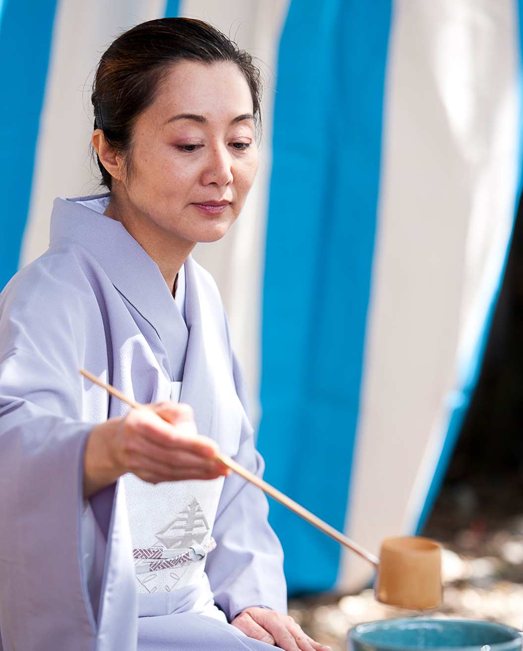 woman Japanese tea ceremony. Matsuri Festival