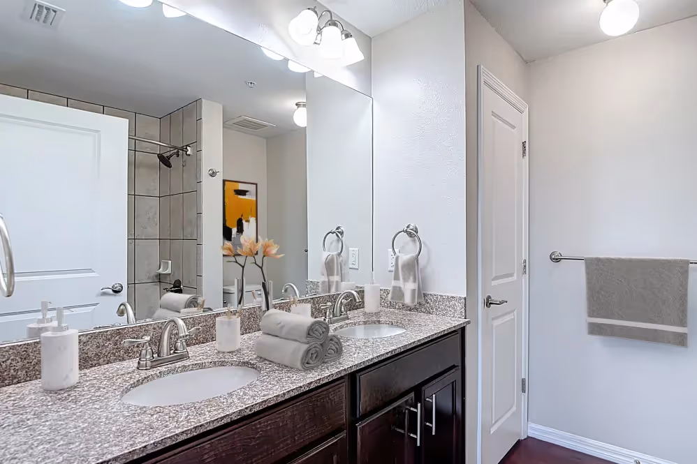 Bathroom with brown cabinets 