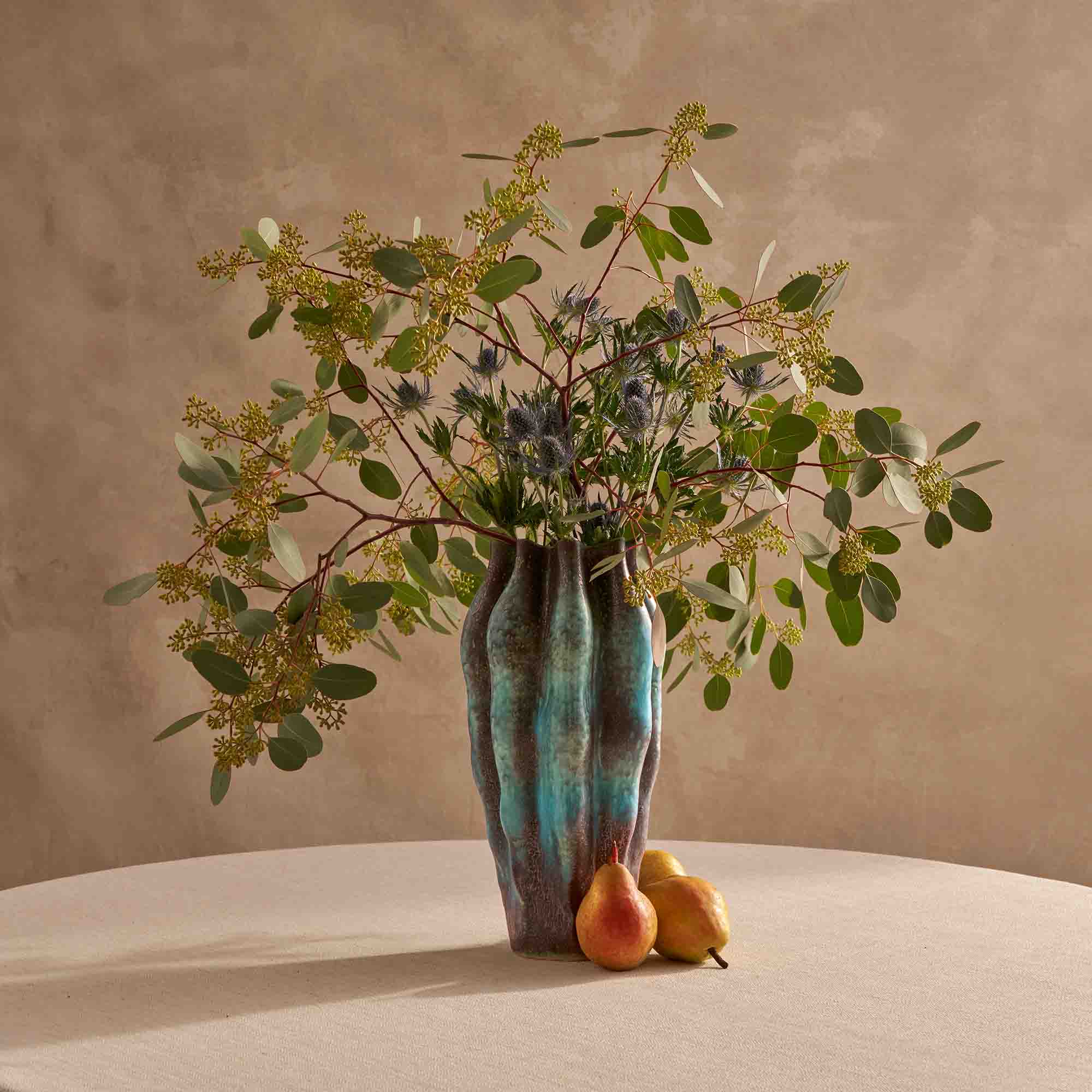 L'Object vase decorates an elegant tabletop