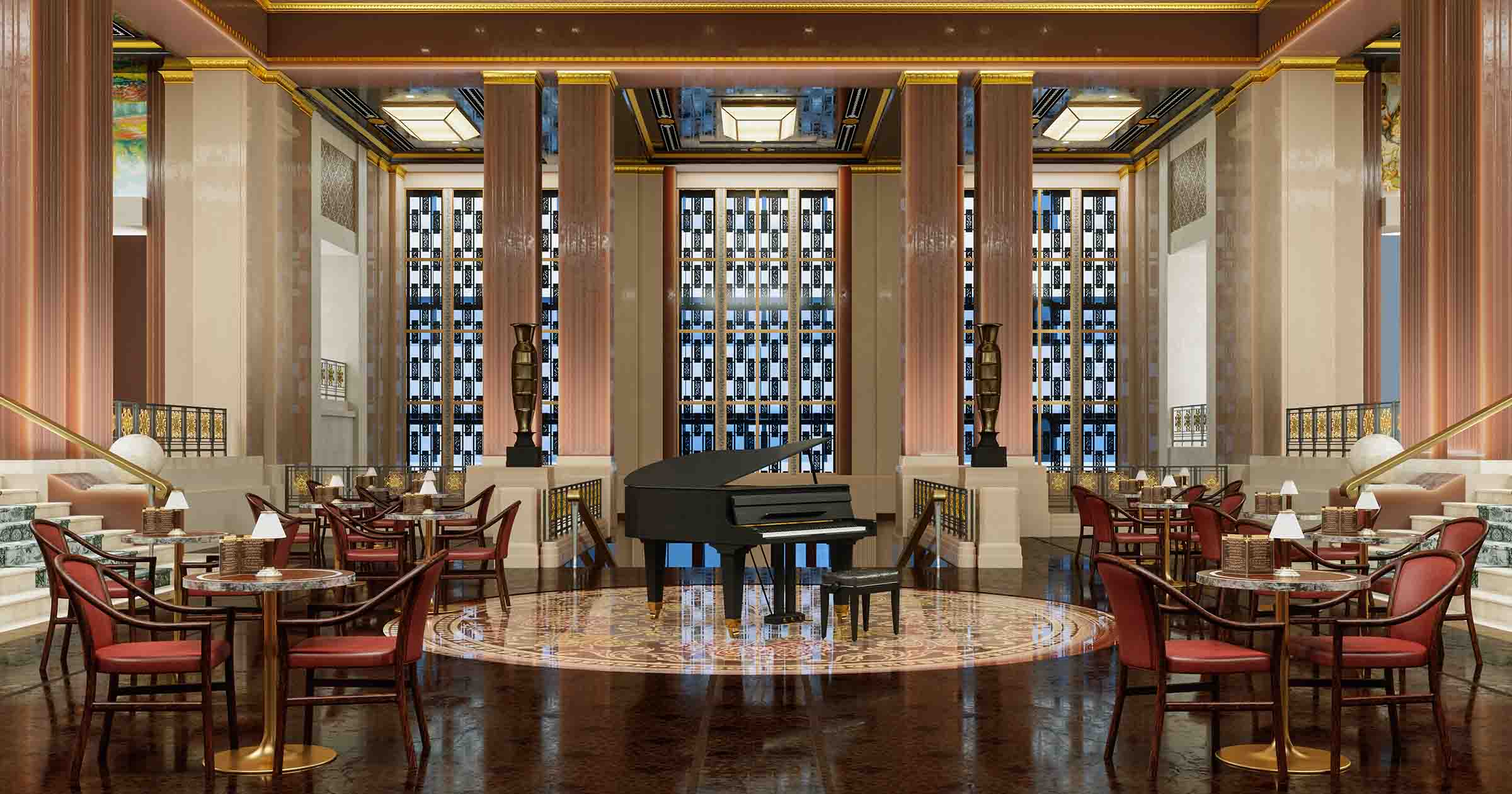 Two small round tables set with glasses, black napkins, and cutlery next to a blue upholstered bench in a cozy restaurant interior with muted brown walls.