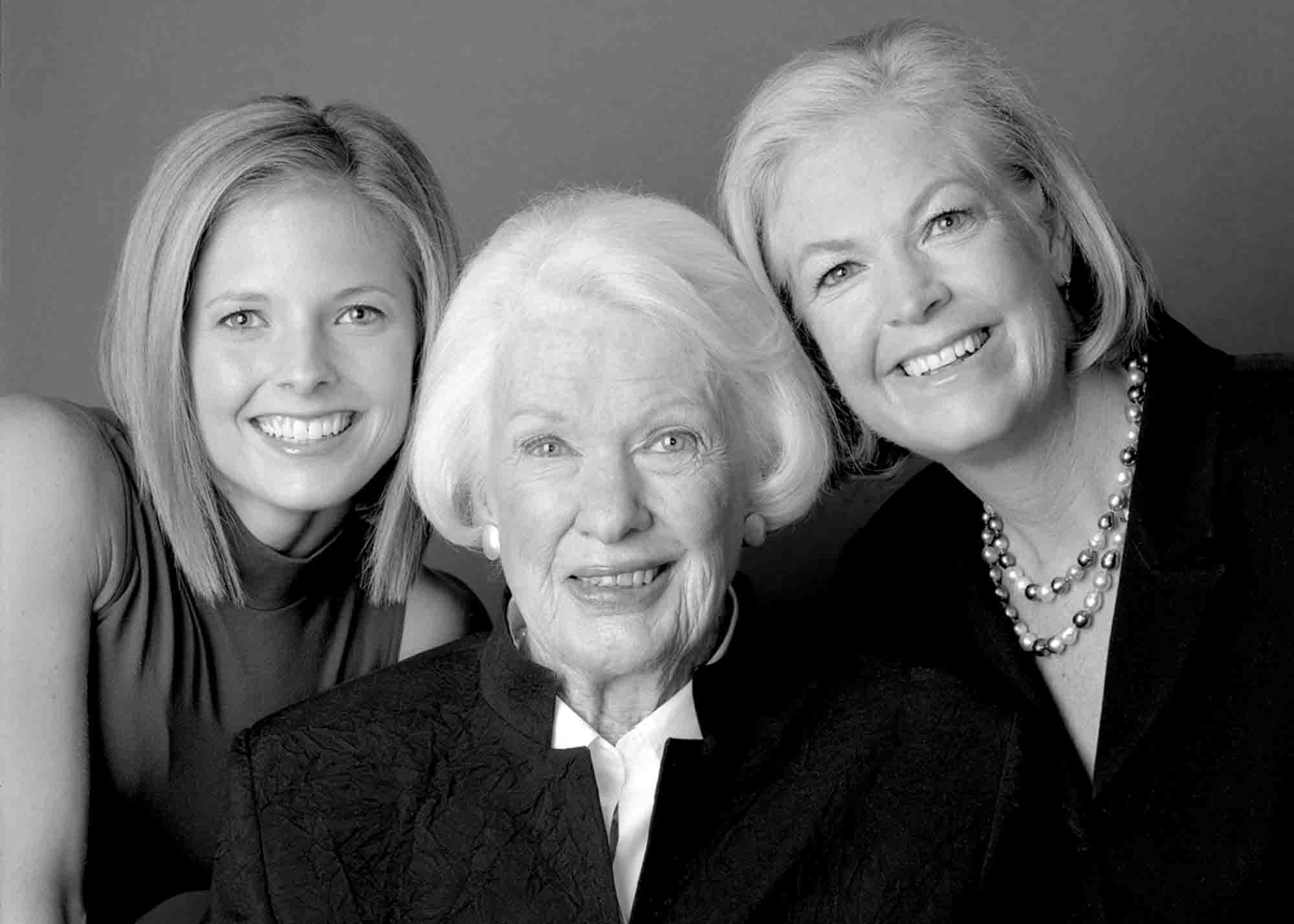 Black and white portrait of three smiling women representing three generations of Ski and Sea.