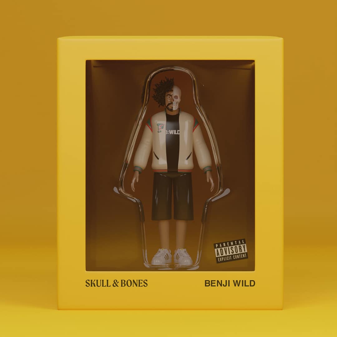 Figurine of a man with half a skull face inside a yellow box with text 'SKULL & BONES' and 'BENJI WILD'.