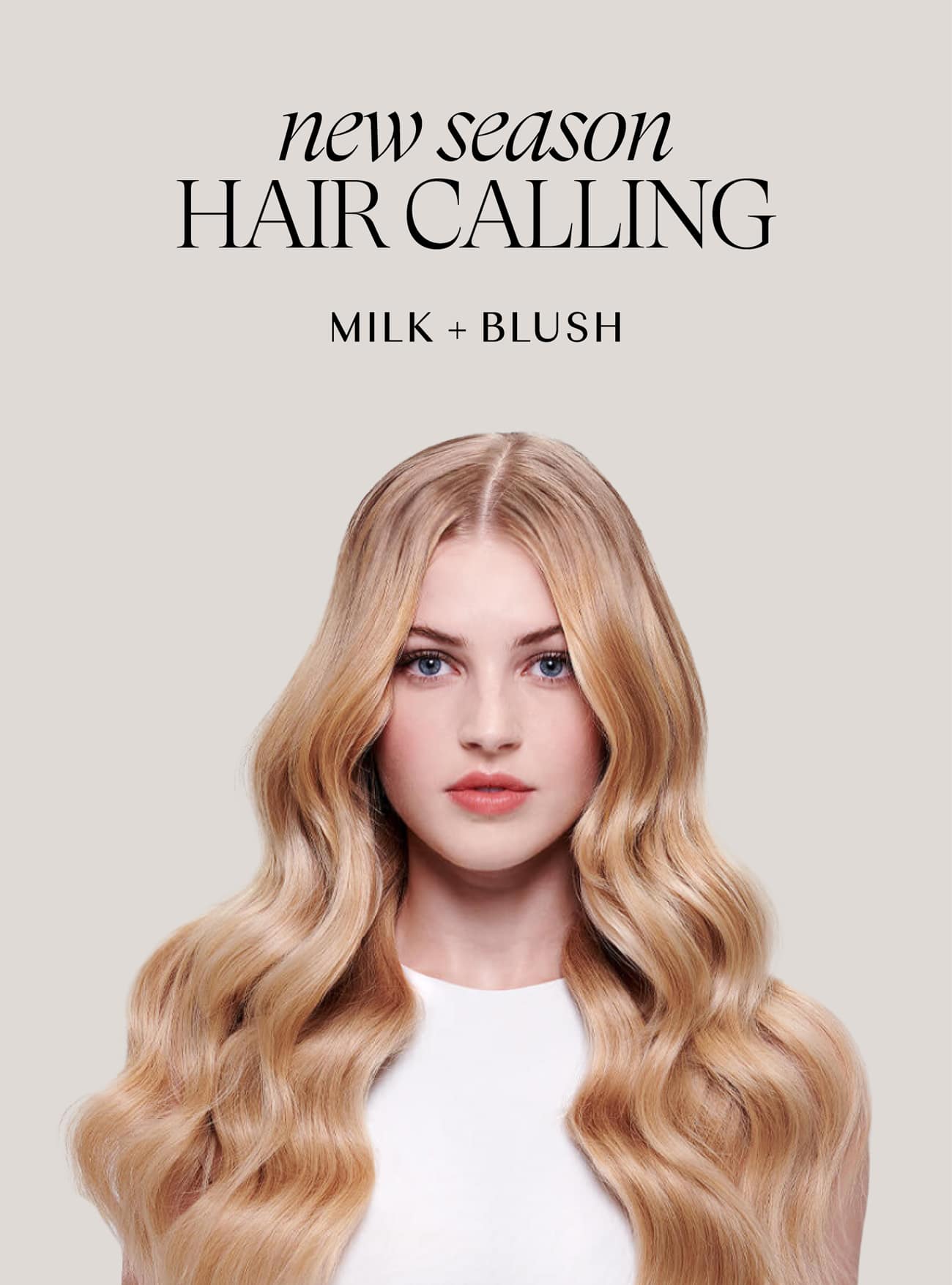 Blonde woman with long, wavy hair wearing a white top under text reading new season hair calling milk + blush.