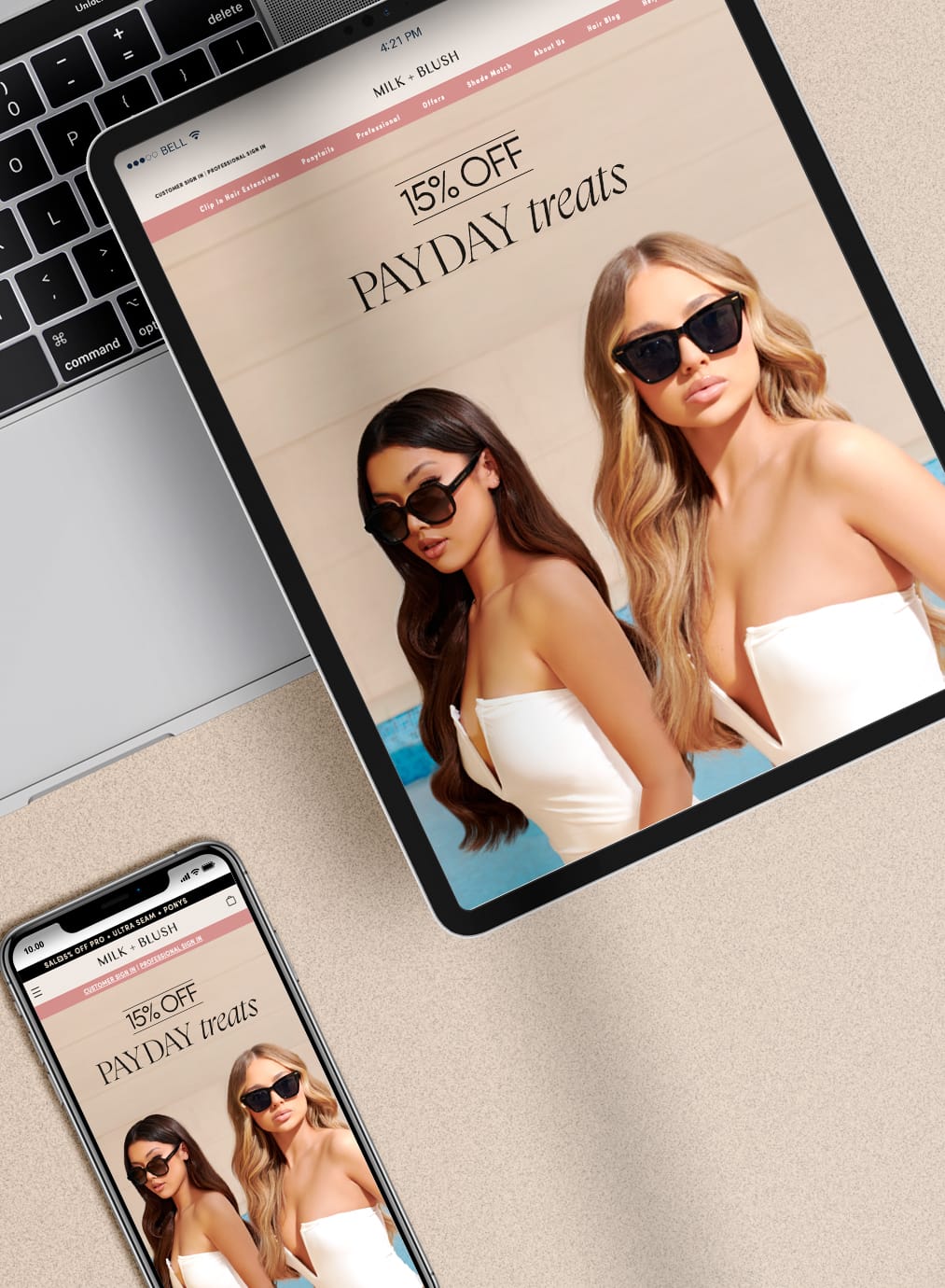 Tablet and smartphone displaying a 15% off payday treats promotion on the Milk + Blush website with two women wearing white tops and sunglasses.