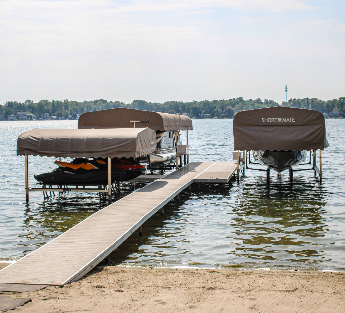 Boat lifts with canopies and a dock on a West Michigan lake