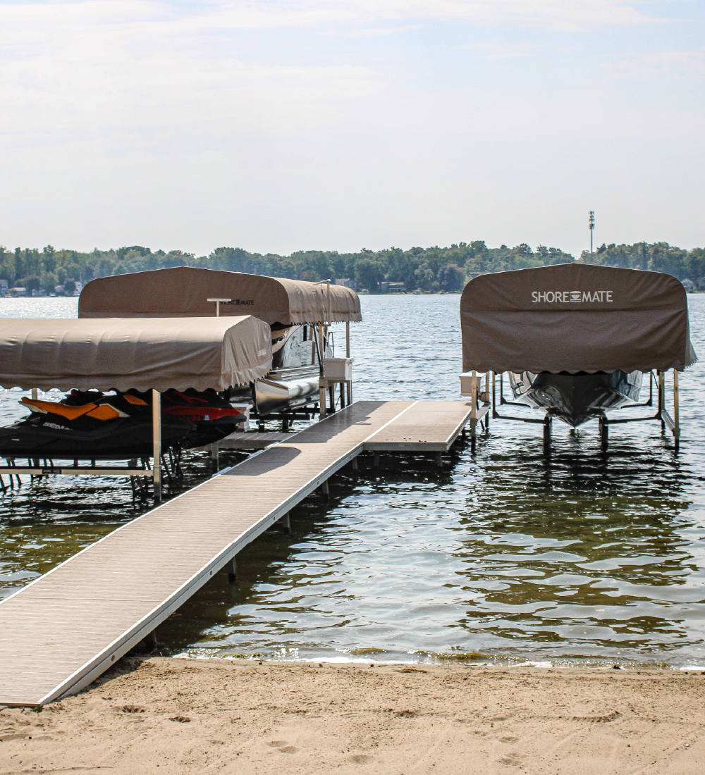 Boat lifts with canopies and a dock on a West Michigan lake