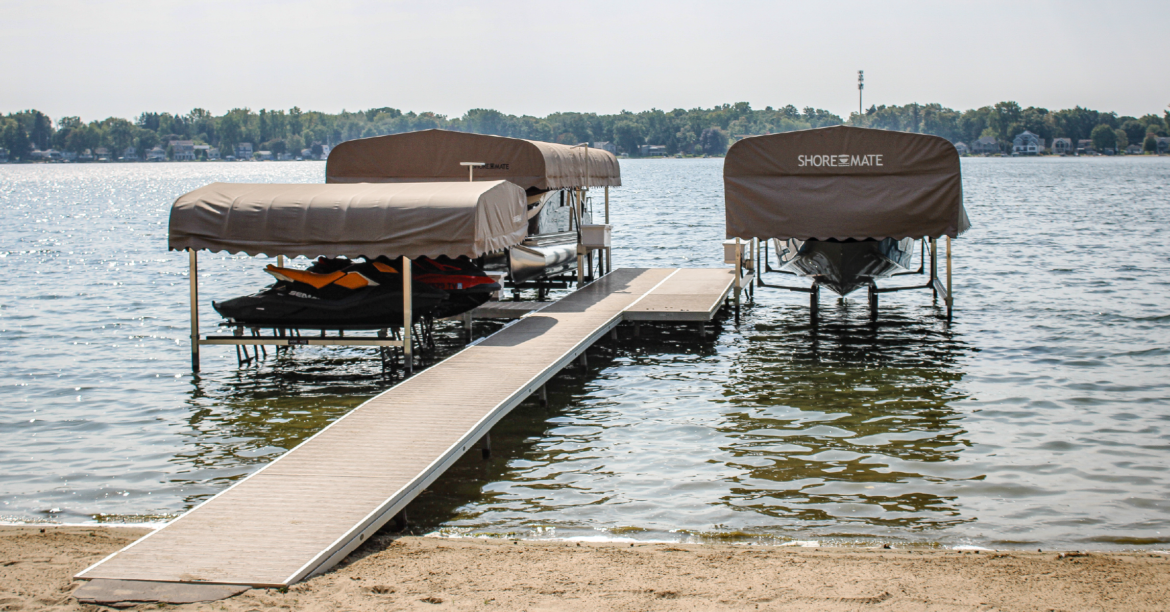 Boat lifts with canopies and a dock on a West Michigan lake