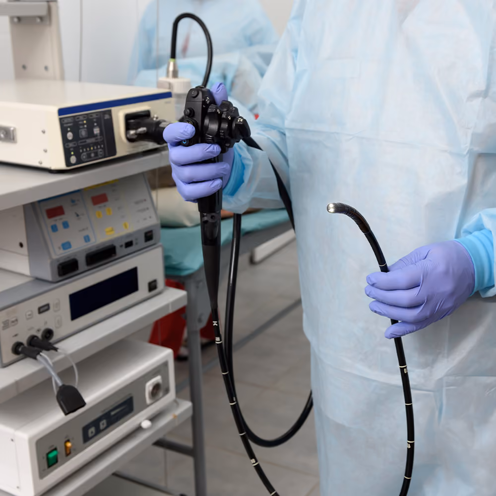 Healthcare professional preparing an endoscope for the diagnosis and monitoring of inflammatory bowel disease (IBD).