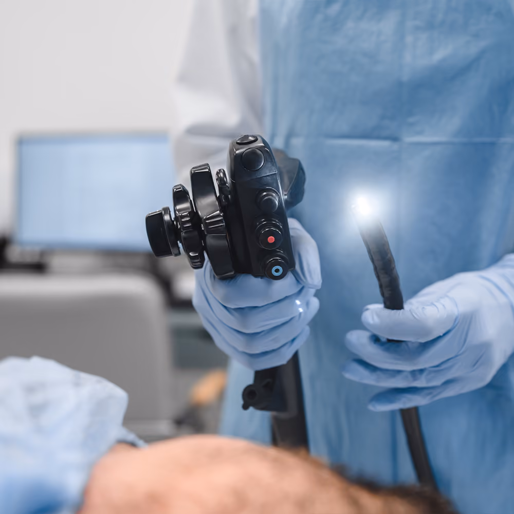 Healthcare professional preparing an endoscope for an upper gastrointestinal endoscopy to diagnose or confirm coeliac disease.