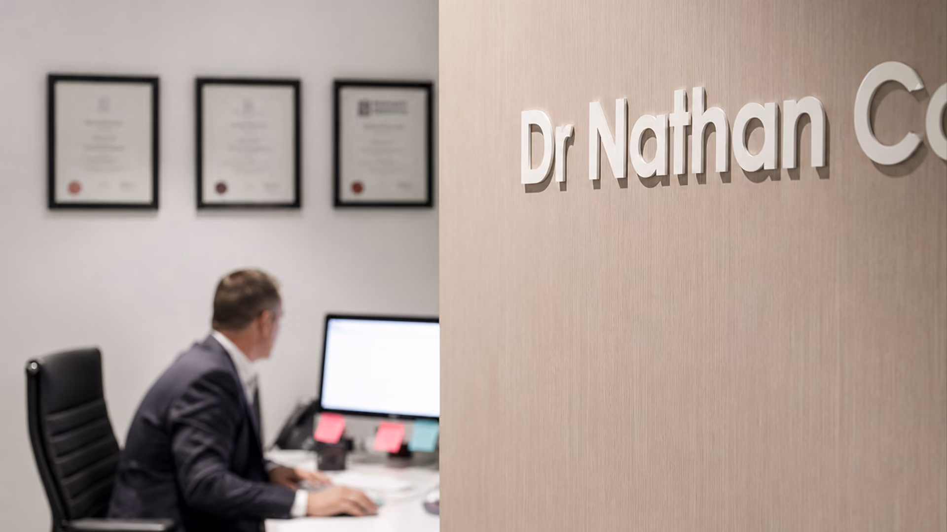 A close up image of the Dr Nathan Connelly’s office door during a consultation.