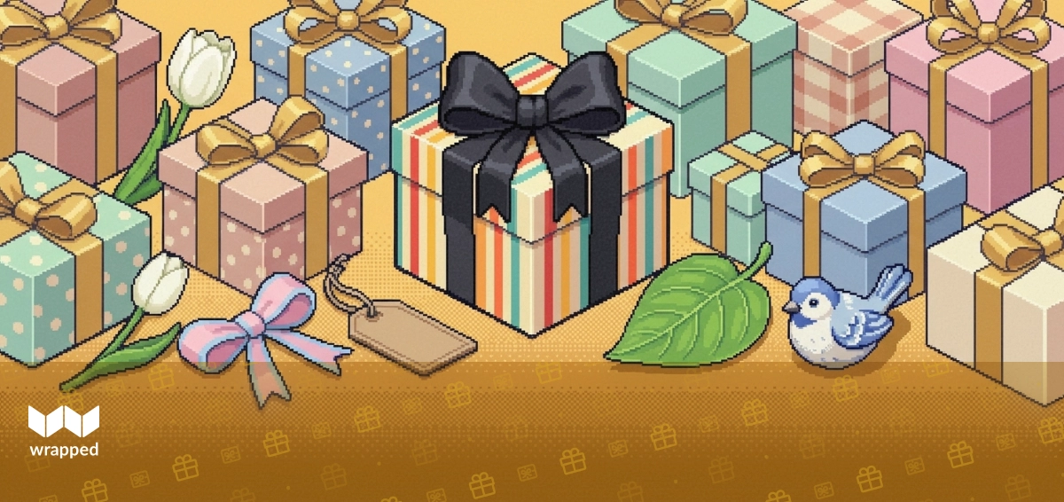 A bouquet of spring flowers wrapped in paper sitting on a wooden countertop next to a handwritten gift note