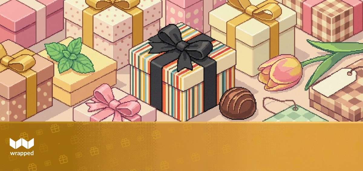 A curated gift box of gourmet food and baked goods wrapped with a ribbon on a kitchen counter