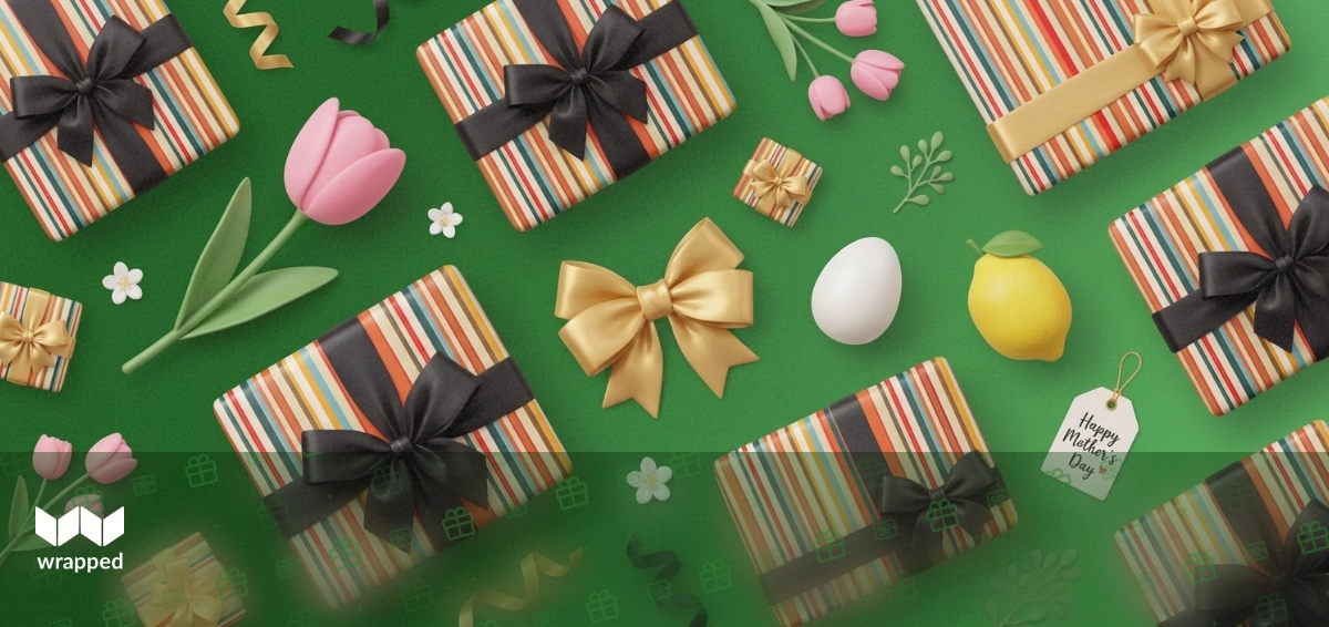 A colorful spring bouquet and wrapped gift box on a table, symbolizing Mother's Day gifting preparations