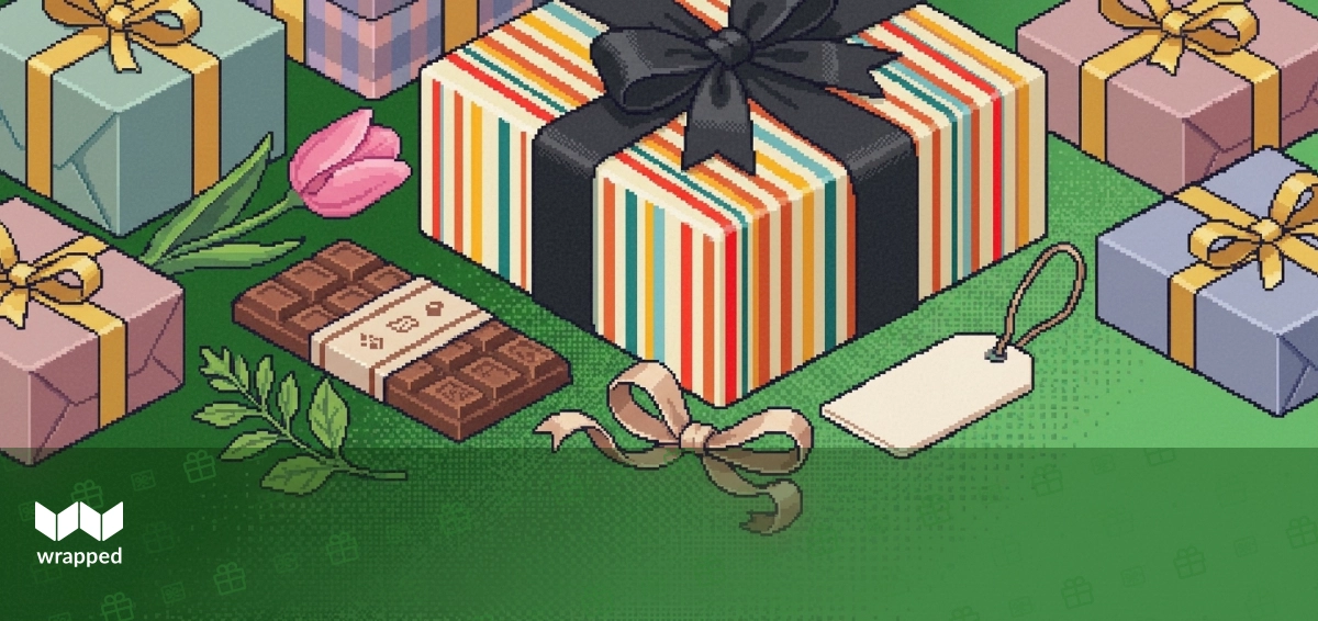 A curated food gift box with a handwritten card surrounded by spring flowers on a kitchen table