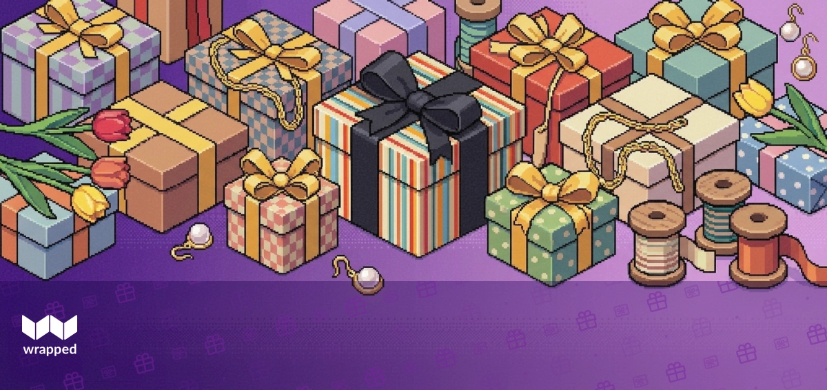 A delicate necklace resting on a gift box surrounded by wrapping paper and a handwritten card on a spring table