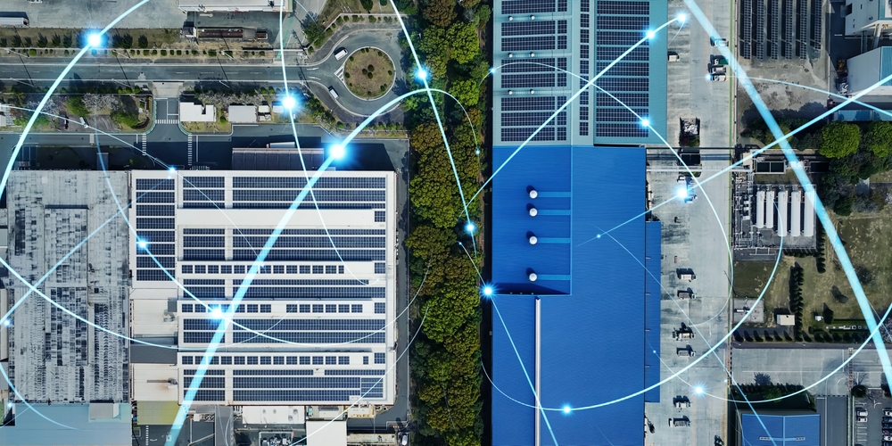 Aerial drone view of an industrial area with a communication network overlay