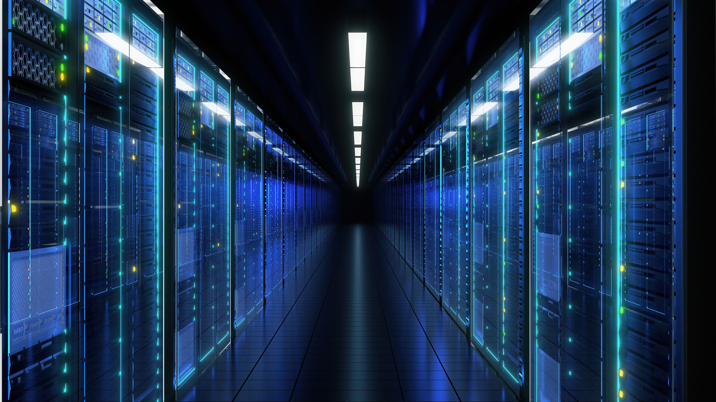 Long corridor inside a data center lined with server racks on both sides illuminated with blue and green lights.