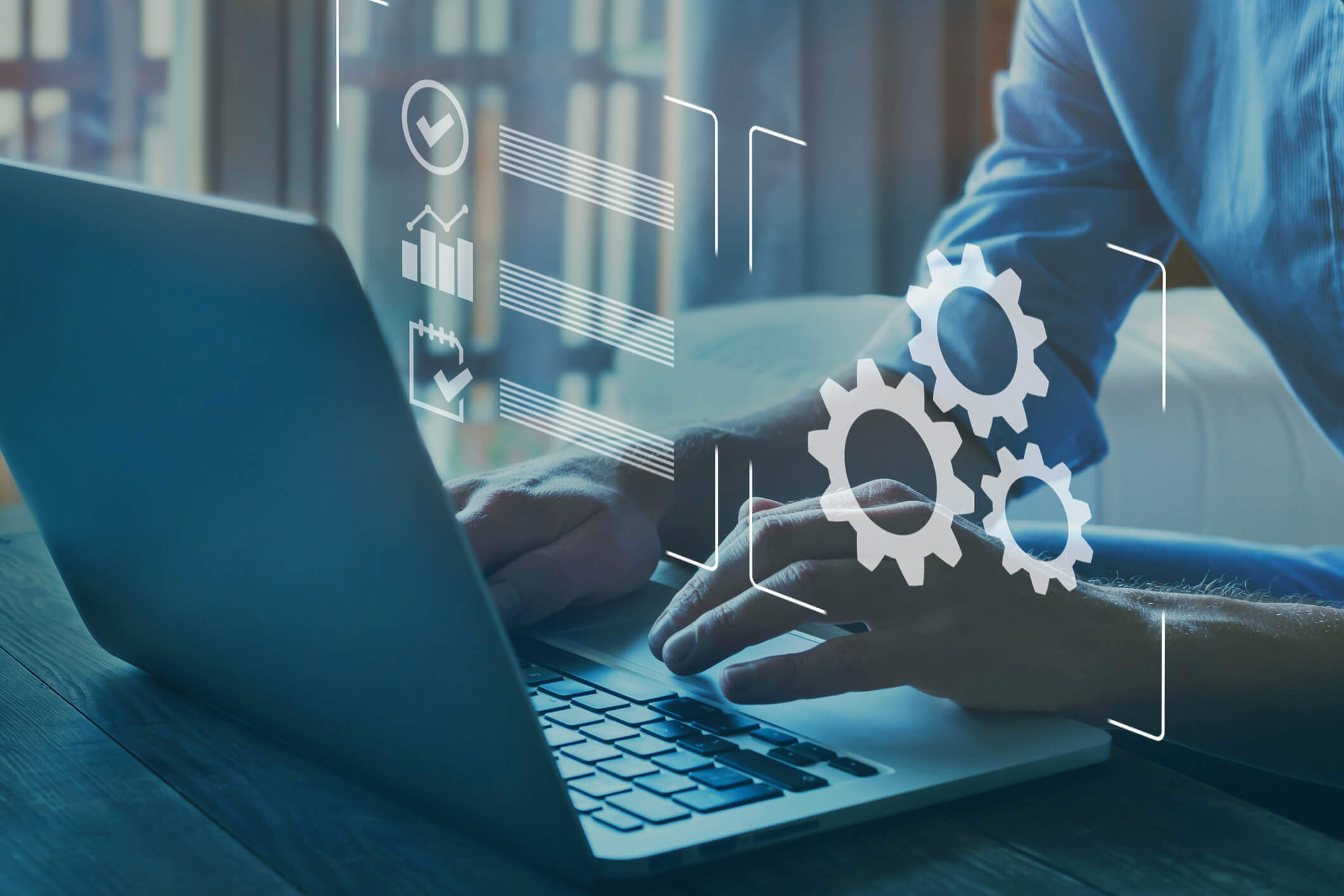 Close-up of hands typing on a laptop keyboard with overlaid digital icons including gears, check marks, and a bar graph, symbolizing technology and process management.