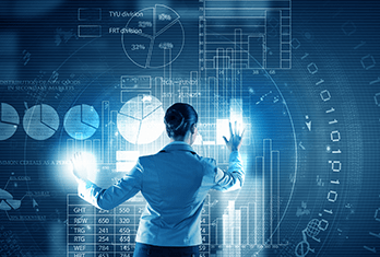 A businesswoman interacting with futuristic transparent digital data displays, showing charts, graphs, and numbers on a blue background.