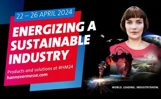Promotional banner for Hannover Messe 2024, April 22-26, with slogan Energizing a Sustainable Industry, showing a woman, industrial robotic arm emitting sparks, wind turbines, and the Earth with flying birds, highlighting products and solutions at #HM24.