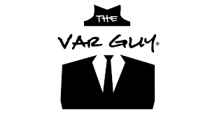 Black and white logo depicting a stylized suit and tie with the word 'THE' above it and 'VAR GUY' written in a handwritten style.
