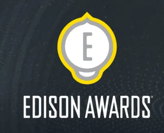 White Edison Awards logo with a stylized light bulb and letter E outlined in yellow on a dark textured background.