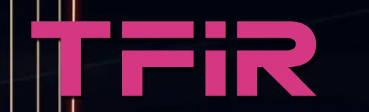Logo with stylized magenta letters spelling 'TFIR' on a dark background with vertical light streaks.
