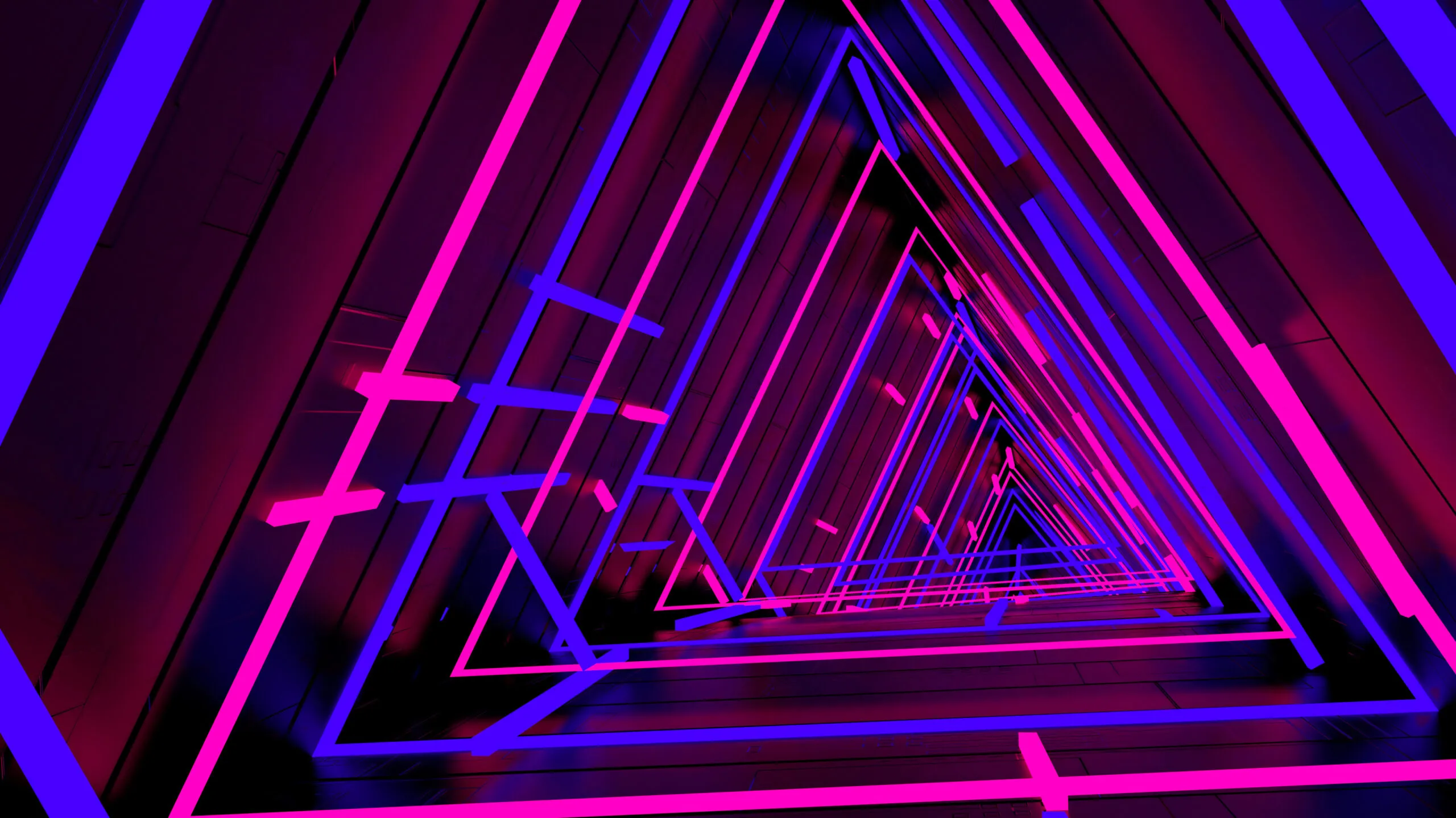 Abstract tunnel of repeating triangular frames illuminated with alternating neon pink and blue lights, creating a futuristic geometric pattern.