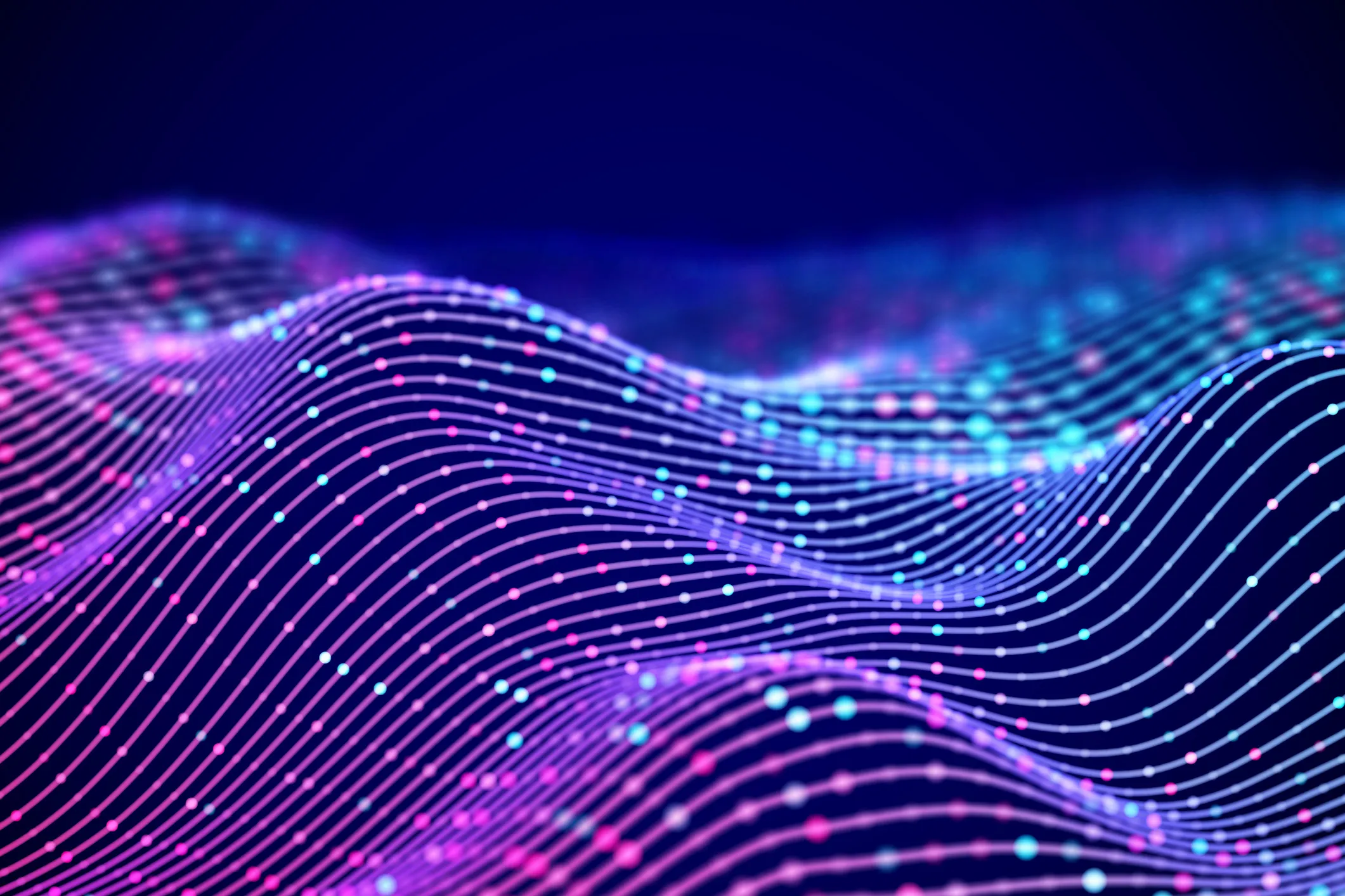 Abstract digital waves composed of flowing purple lines and colorful nodes in pink, blue, and white on a dark background.