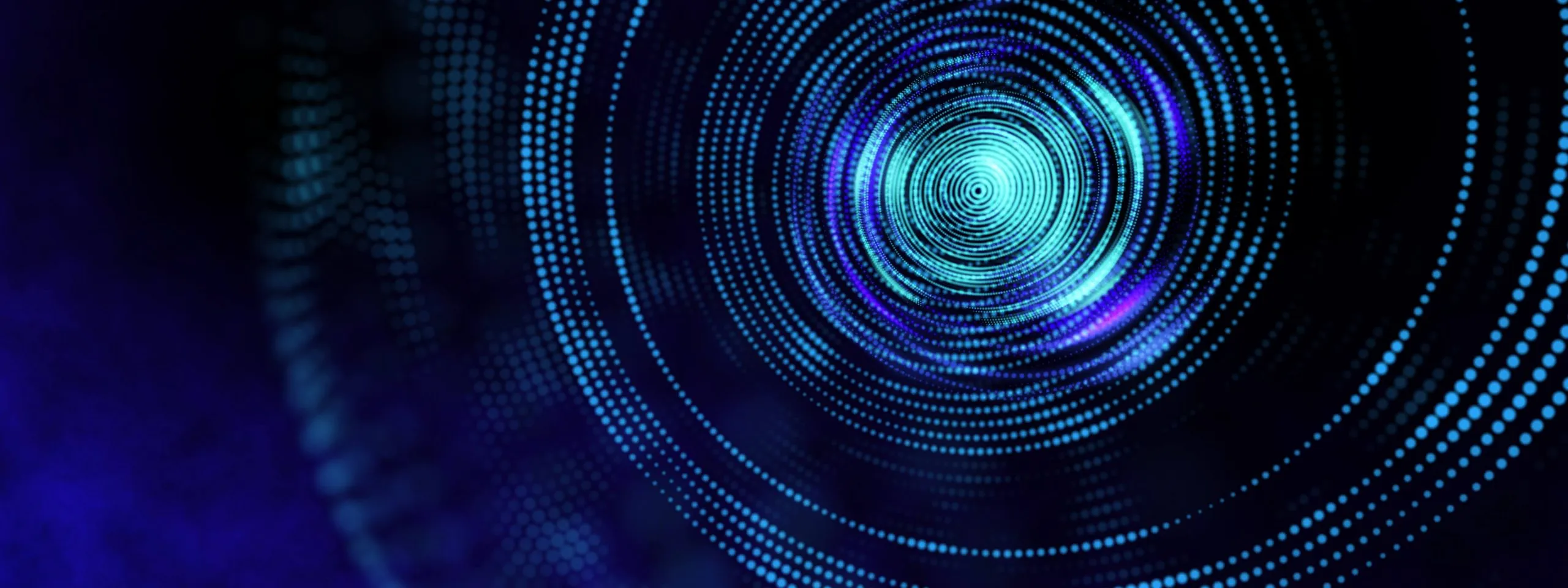 Abstract digital art featuring concentric circles made of glowing blue and purple dots on a dark background, resembling a lens or vortex.