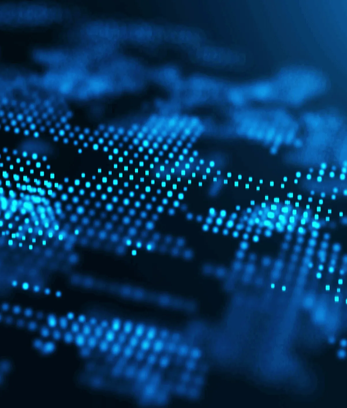 Close-up of a digital blue dot matrix pattern with many glowing squares creating an abstract, futuristic texture on a dark background.
