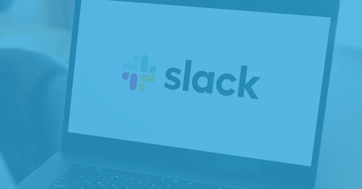 Laptop screen displaying the Slack logo, featuring the multicolored hashtag symbol and the word 'slack' in lowercase letters.