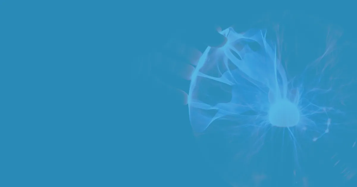 Hand touching a glowing plasma ball with blue electrical filaments inside against a dark background.